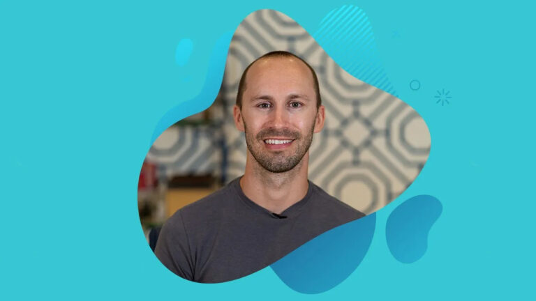 A man smiling with braces, wearing a gray shirt against a geometric patterned background with abstract blue shapes, reminiscent of Miami Designer Smiles.