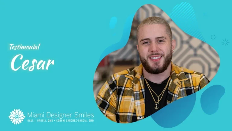 A smiling man with a beard and short blond hair wearing a yellow plaid shirt shares his testimonial for Miami Designer Smiles after undergoing Full Mouth Rehabilitation in Miami.